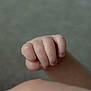 baby, hand, fist, skin, closeup, infant, newborn, wrinkles, delicate, soft, palm, child, fingers, cute, small, natural, innocence, texture, blurred_background, gentle