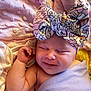 baby, sleeping, headband, bow, blanket, soft_texture, infant, cute, smile, wrapped, cozy, pink, lavender, floral, newborn, child, resting, peaceful, closeup, skin
