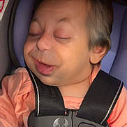 Everleigh joined the competition — help win amazing prizes! baby, baby_face, blanket, car_seat, child, close_up, cushion, face, head, indoors, infant, infant_clothing, person, pink_clothing, resting, seat, seat_belt, sleeping, straps, young_child