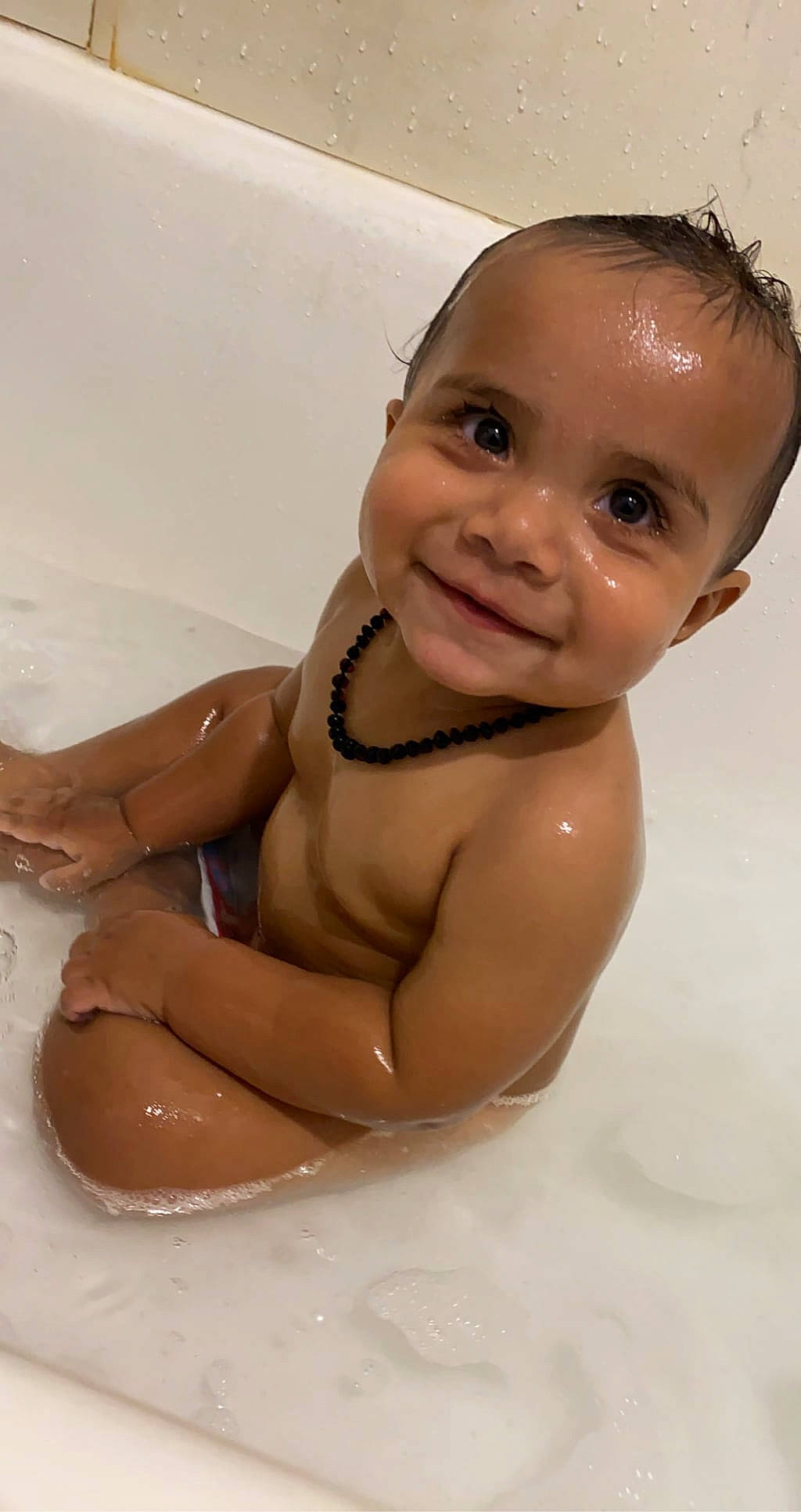 Heath is registered to the contest to win money with this photo: baby, baby_bathing, bathing, bathroom, bathtub, cheek, chest, eye, eyebrow, fluid, hair, happy, human_body, iris, joy, nose, person, skin, smile, toddler
