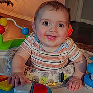 Tre joined the competition — help win amazing prizes! baby, child, smiling, toy, piano, activity_center, indoor, home, happy, playing, infant, colorful, furniture, person, cute, joyful, hands, face, clothing, floor