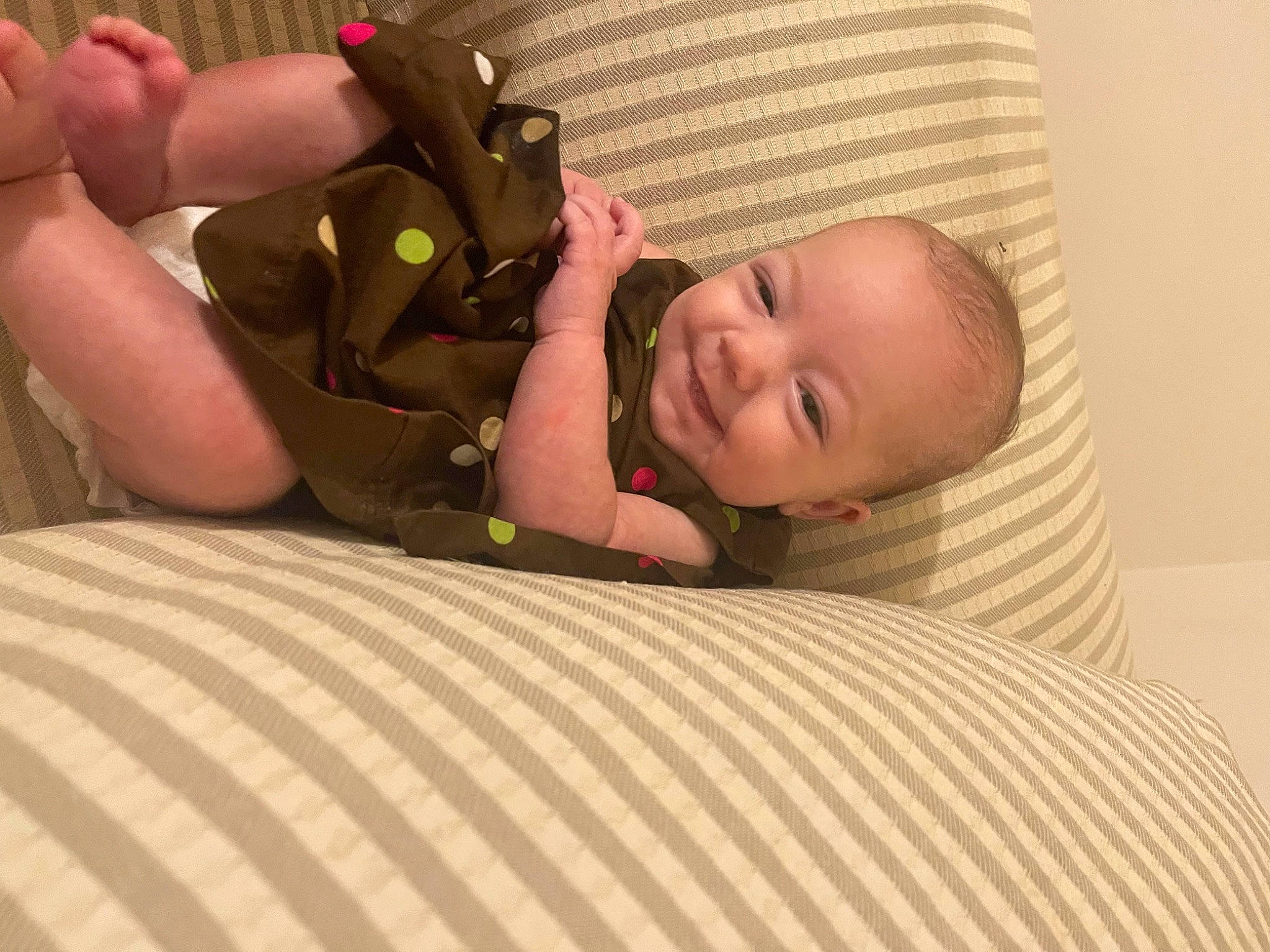 Gracelynn is registered to the contest to win money with this photo: baby, baby_products, baby_safety, baby_sleeping, baby_toddler_clothing, bed, bedding, bedtime, chair, comfort, flooring, fun, linens, person, room, sitting, skin, smile, thumb, toddler