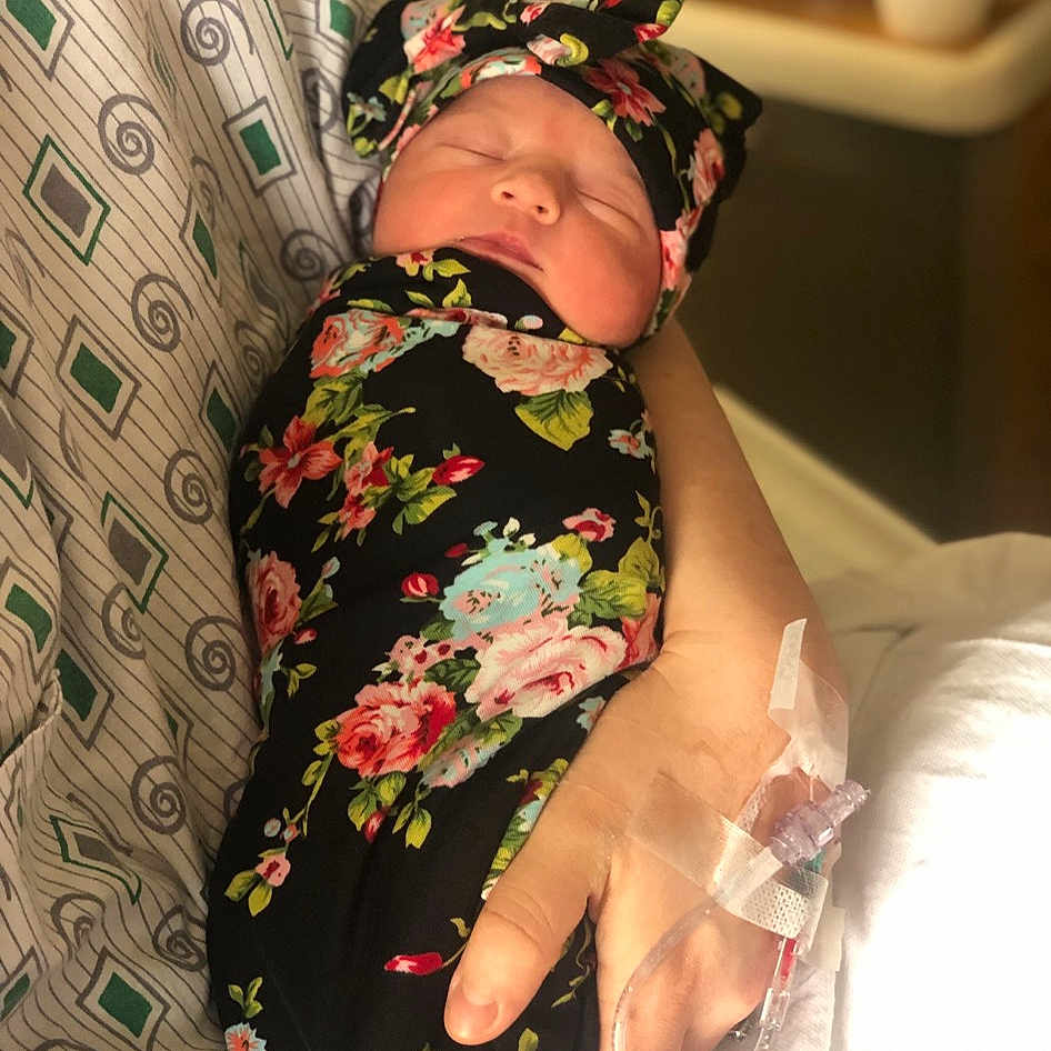 Gracelynn is registered to the contest to win money with this photo: abdomen, baby, baby_toddler_clothing, comfort, dress, event, gesture, head, headpiece, human_body, human_leg, nail, pattern, peach, petal, sleeve, thigh, thumb, toddler, wrist