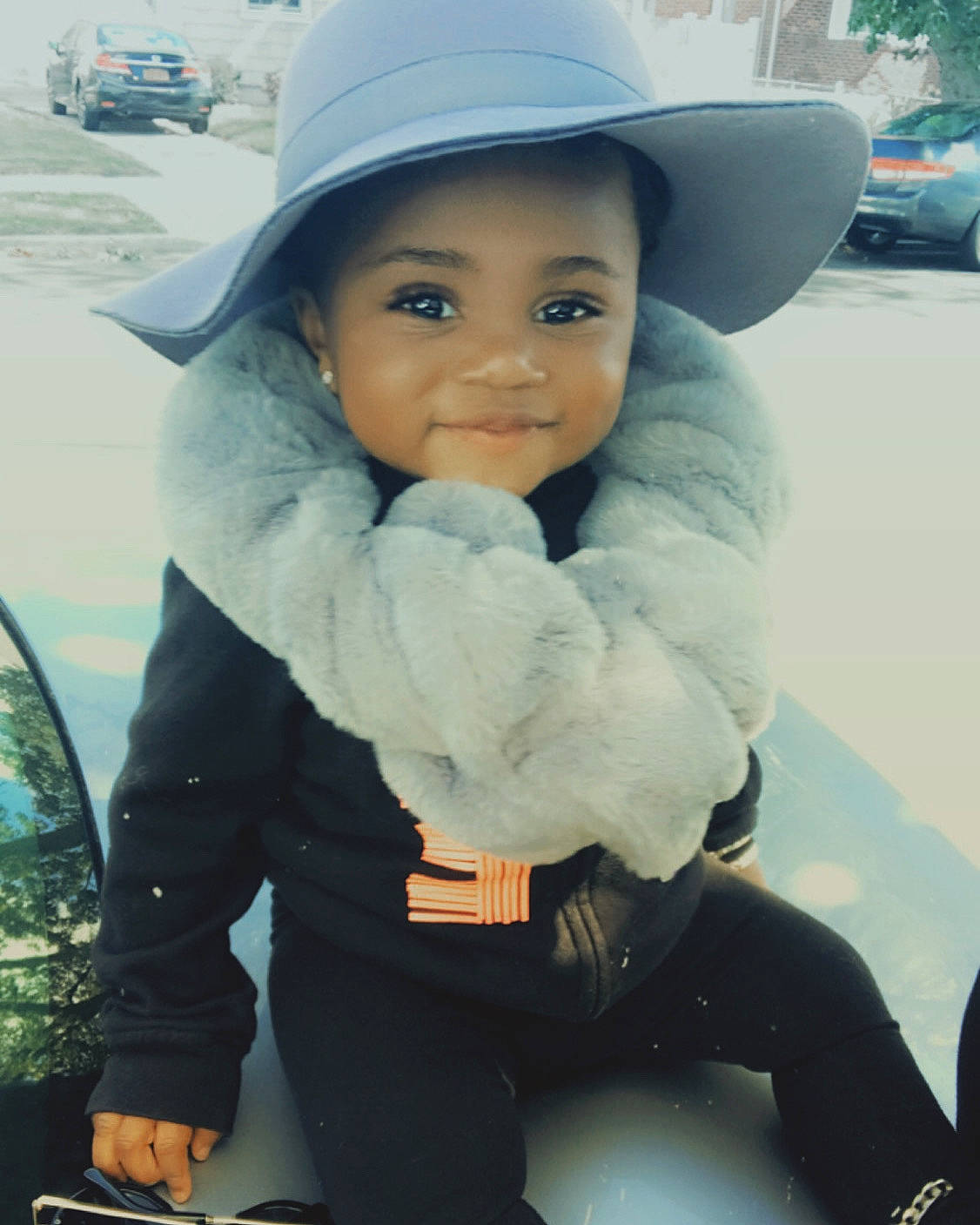 Abigail is registered to the contest to win money with this photo: baby, black_hair, cheek, child, cool, face, fashion_accessory, hat, head, headgear, headwear, joy, lip, outerwear, person, skin, smile, sun_hat, toddler