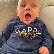 Isandro a rejoint le concours — aidez-le/la à gagner de superbes lots ! baby, blue_eyes, child, clothing, cozy, cushion, cute, expression, hand, happy_boy, indoor, infant, light, mouth_open, navy, person, portrait, seated, soft_texture, sweater