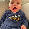 baby, blue_eyes, child, clothing, cozy, cushion, cute, expression, hand, happy_boy, indoor, infant, light, mouth_open, navy, person, portrait, seated, soft_texture, sweater