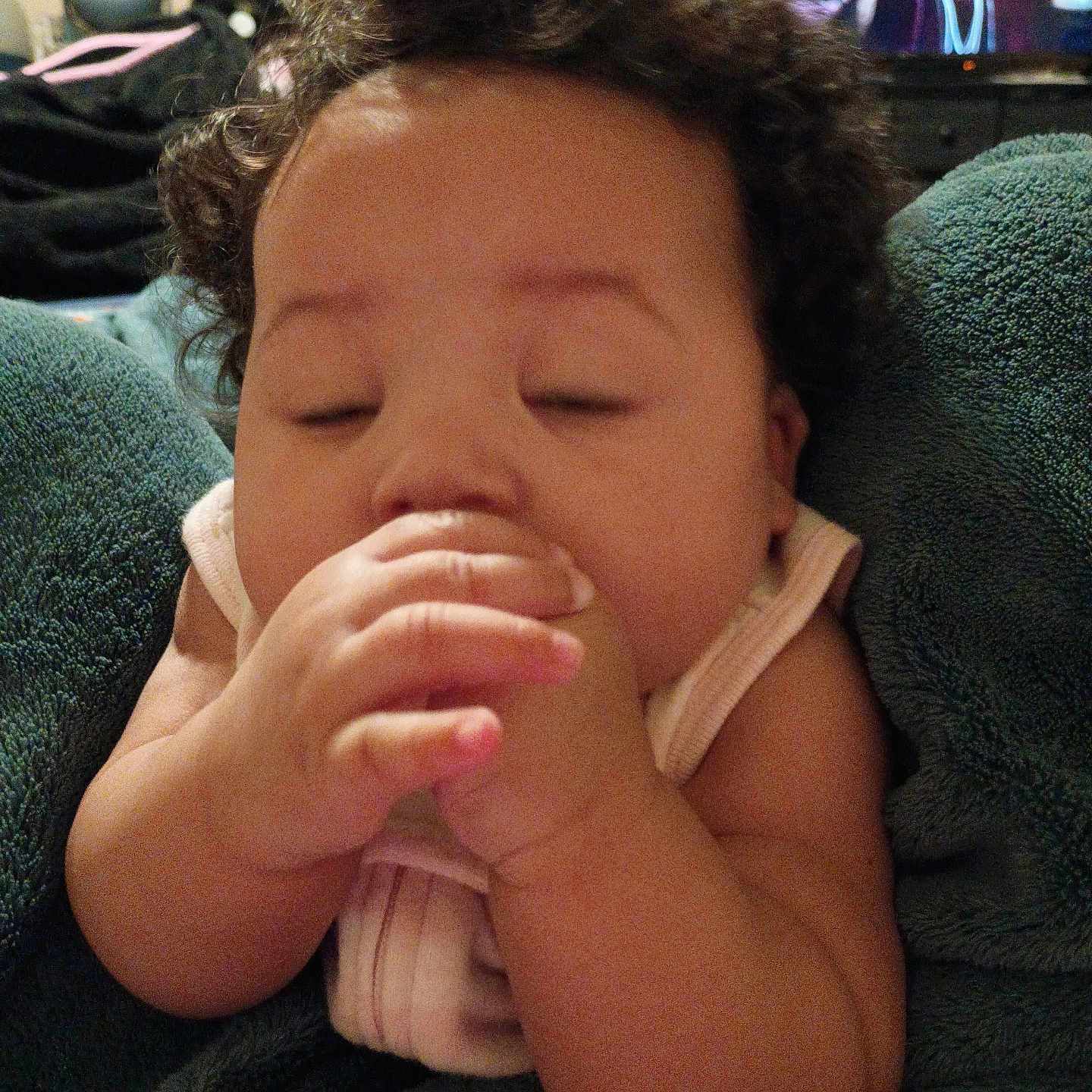 Musica is registered to the contest to win money with this photo: baby, blanket, child, closeup, comfort, cozy, curly_hair, cute, face, hand, indoors, infant, nap, person, relaxed, resting, skin, sleepy, soft, warm