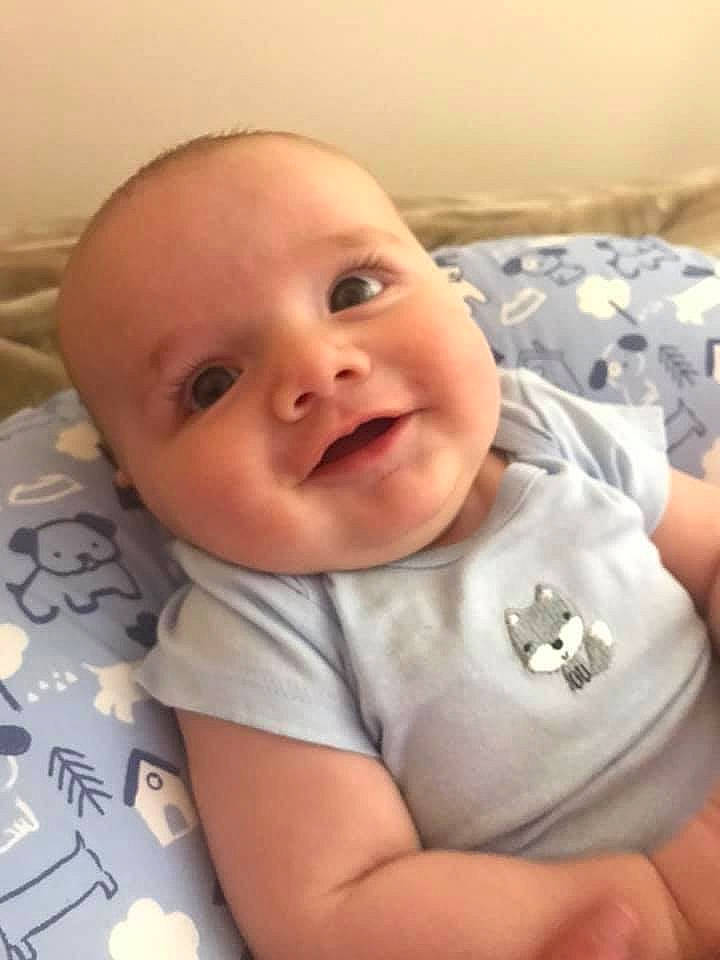 William is registered to the contest to win money with this photo: baby, baby_making_funny_faces, cheek, child, chin, ear, eye, face, facial_expression, forehead, head, lip, mouth, nose, person, skin, smile, toddler