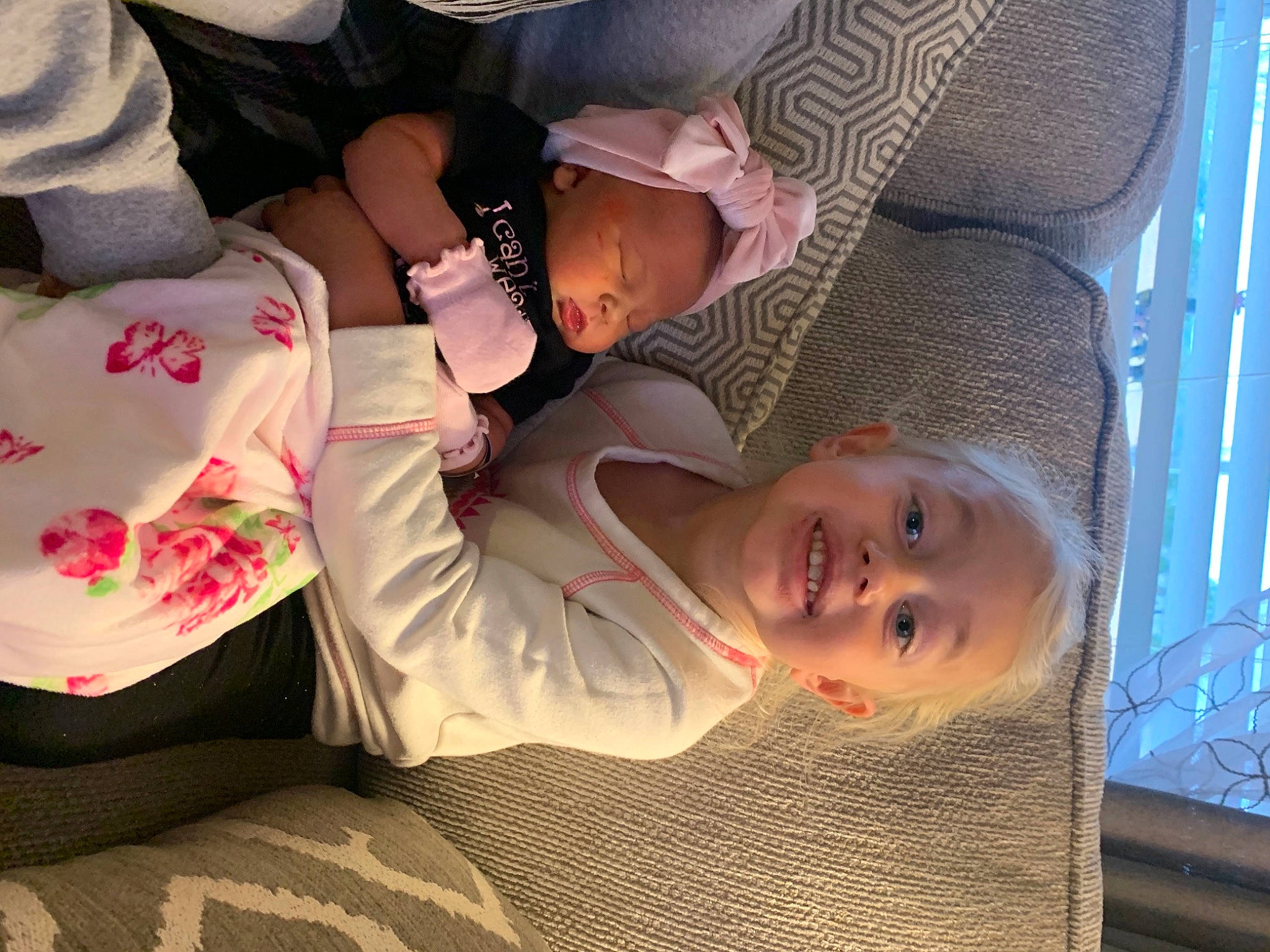 Carrie joined the competition — help win amazing prizes! baby, child, comfort, fun, grass, happy, hat, human_leg, joy, lap, mouth, pattern, person, plant, product, sitting, smile, textile, thigh, toddler