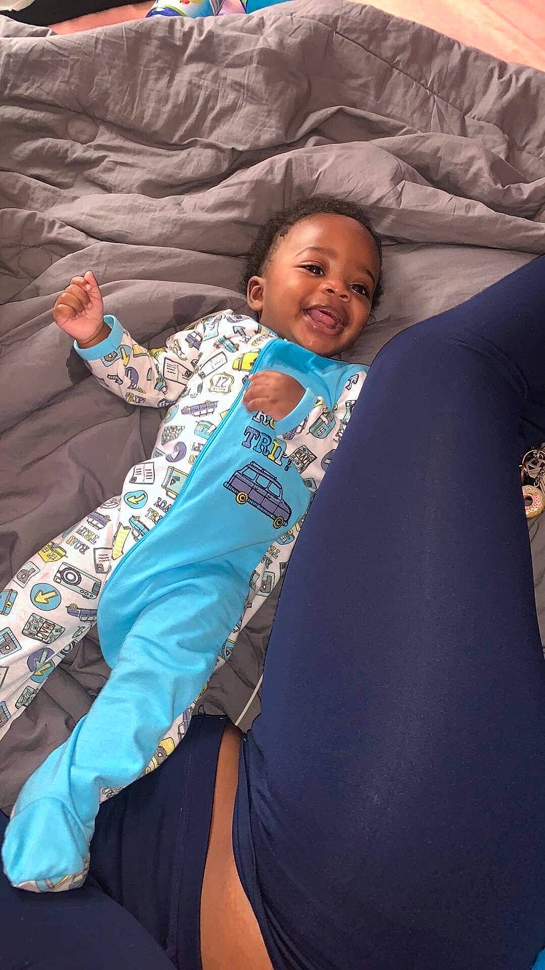 Jr is registered to the contest to win money with this photo: baby, child, fun, joy, person, smile, textile, toddler, vacation