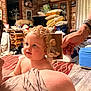 child, toddler, baby, curly_hair, portrait, vintage_photo, hand, living_room, pillows, cushions, rug, wicker_drawer, cabinet, chandelier, person, bare_shoulders, carpet, wooden_floor, nostalgic, family