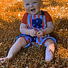 baby, child, infant, smiling, happy, outdoor, grass, lawn, sitting, portrait, face, blue_eyes, overalls, striped_clothing, star_pattern, barefoot, sunlight, autumn, backyard, photography