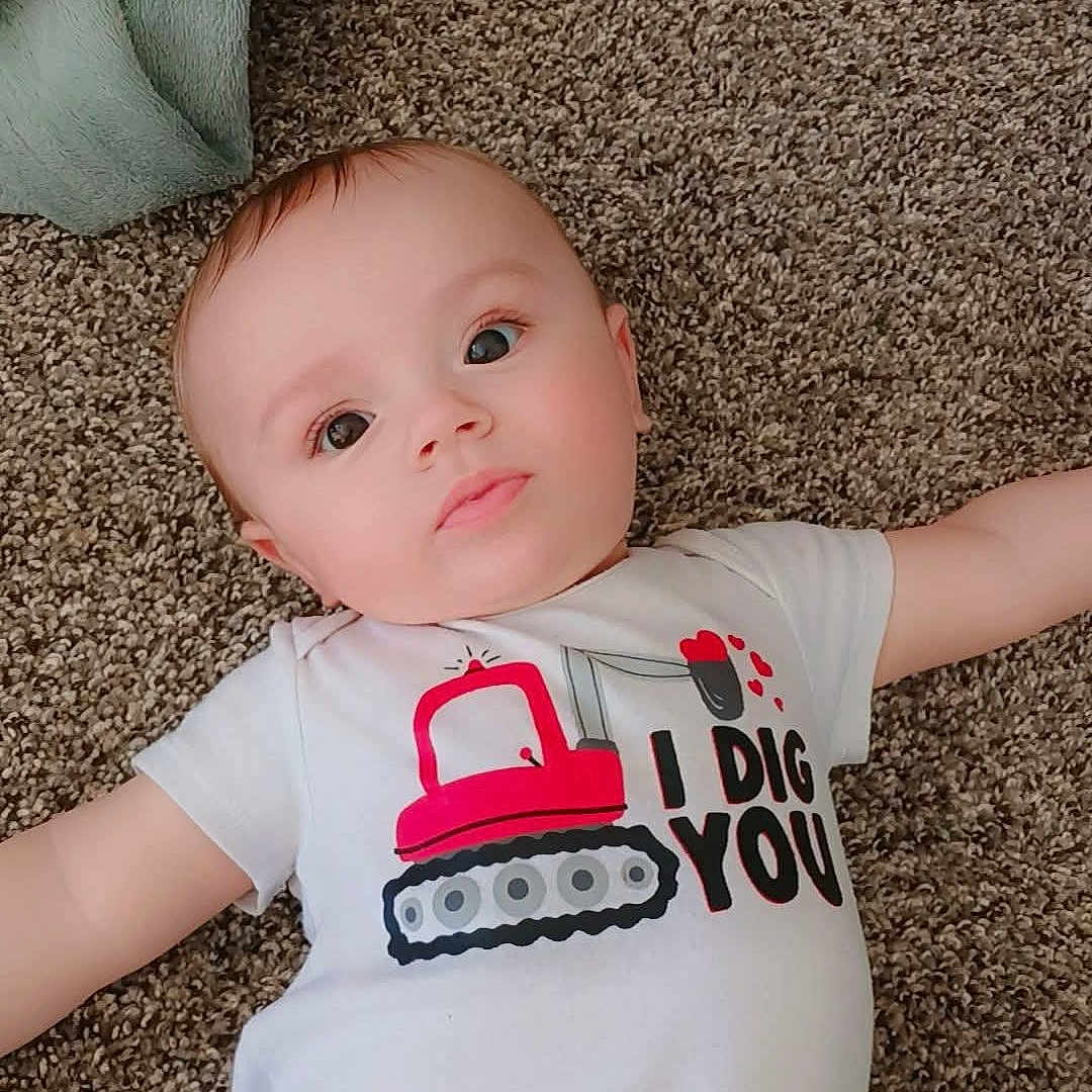 Xander joined the competition — help win amazing prizes! accessories, baby, bed, bedroom, blanket, clothing, cushion, face, furniture, head, homedecor, indoors, newborn, person, photography, portrait, room, shirt, sleeve, t_shirt