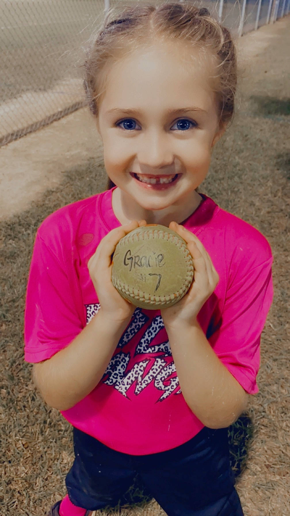 Gracelynn is registered to the contest to win money with this photo: arm, blond, child, eye, finger, grass, hair, happy, hat, head, human_body, joy, neck, people_in_nature, person, pink, shoulder, skin, sleeve, smile