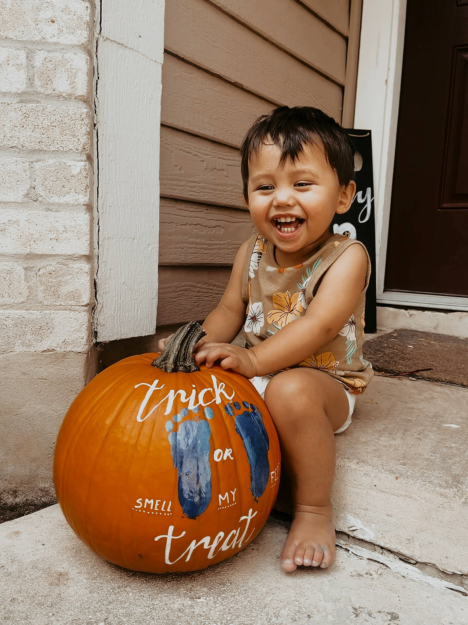 Koda is registered to the contest to win money with this photo: calabaza, child, door, eye, flooring, foot, gourd, happy, human_body, human_leg, leg, natural_foods, person, plant, pumpkin, smile, squash, toddler, vegetable, winter_squash