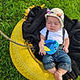 baby, sleeping, denim, hat, knit, plush_toy, blue, yellow_tire, blanket, grass, outdoor, cute, child, suspend, swing, nature, relax, peaceful, infant, clothing