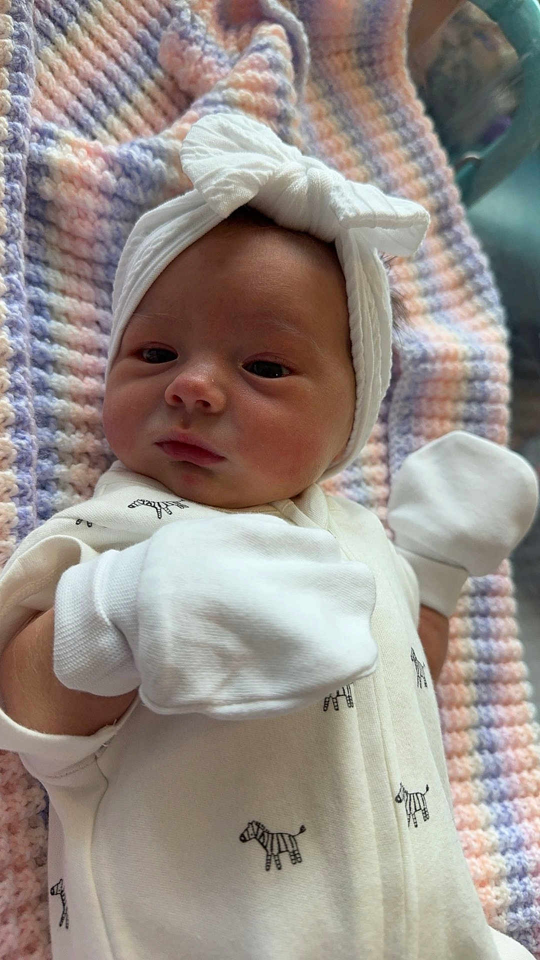 Ophelia is registered to the contest to win money with this photo: baby, bed, blanket, bonnet, cap, clothing, costume, face, furniture, glove, hat, head, newborn, person, photography, portrait, quilt, sleeping, t_shirt, towel