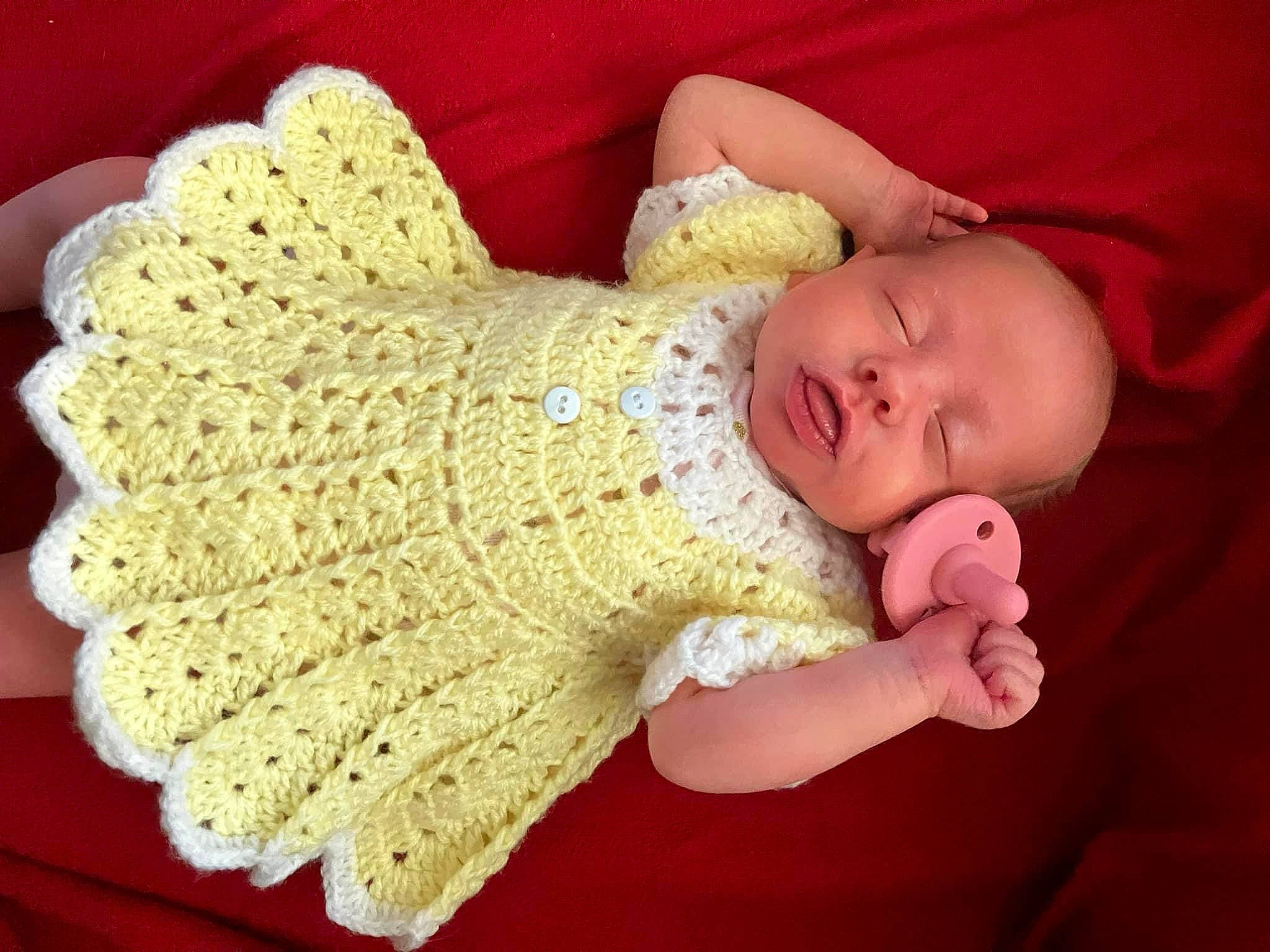 Oaklynn is registered to the contest to win money with this photo: art, baby, baby_sleeping, baby_toddler_clothing, child, comfort, craft, creative_arts, fashion_accessory, finger, hand, headgear, pattern, person, sleeve, textile, thumb, toddler, wool, woolen