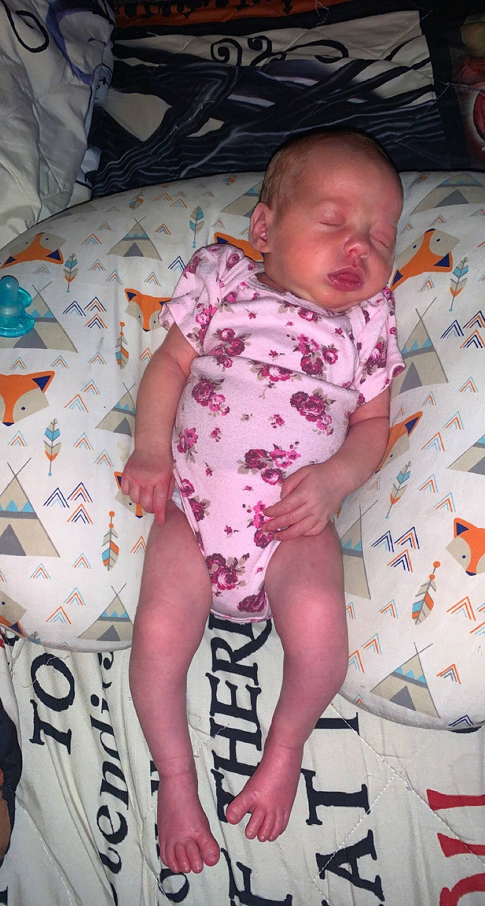 Oaklynn is registered to the contest to win money with this photo: baby, baby_toddler_clothing, child, comfort, foot, human_body, human_leg, knee, lap, linens, nail, pattern, person, pink, sitting, skin, sleeve, textile, thigh, thumb