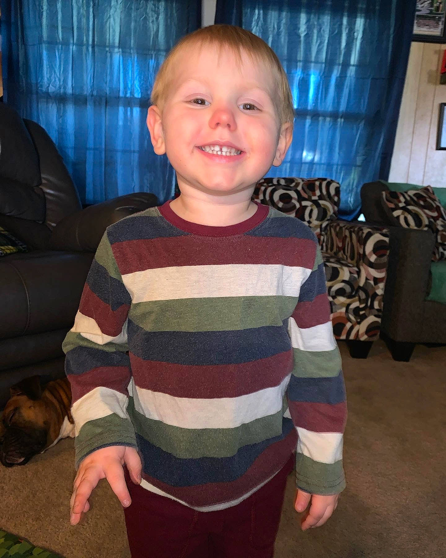 Jesse joined the competition — help win amazing prizes! arm, baby, baby_toddler_clothing, couch, curtain, eye, face, flooring, fun, head, human_body, iris, joy, person, shoulder, sleeve, smile, standing, t_shirt, toddler