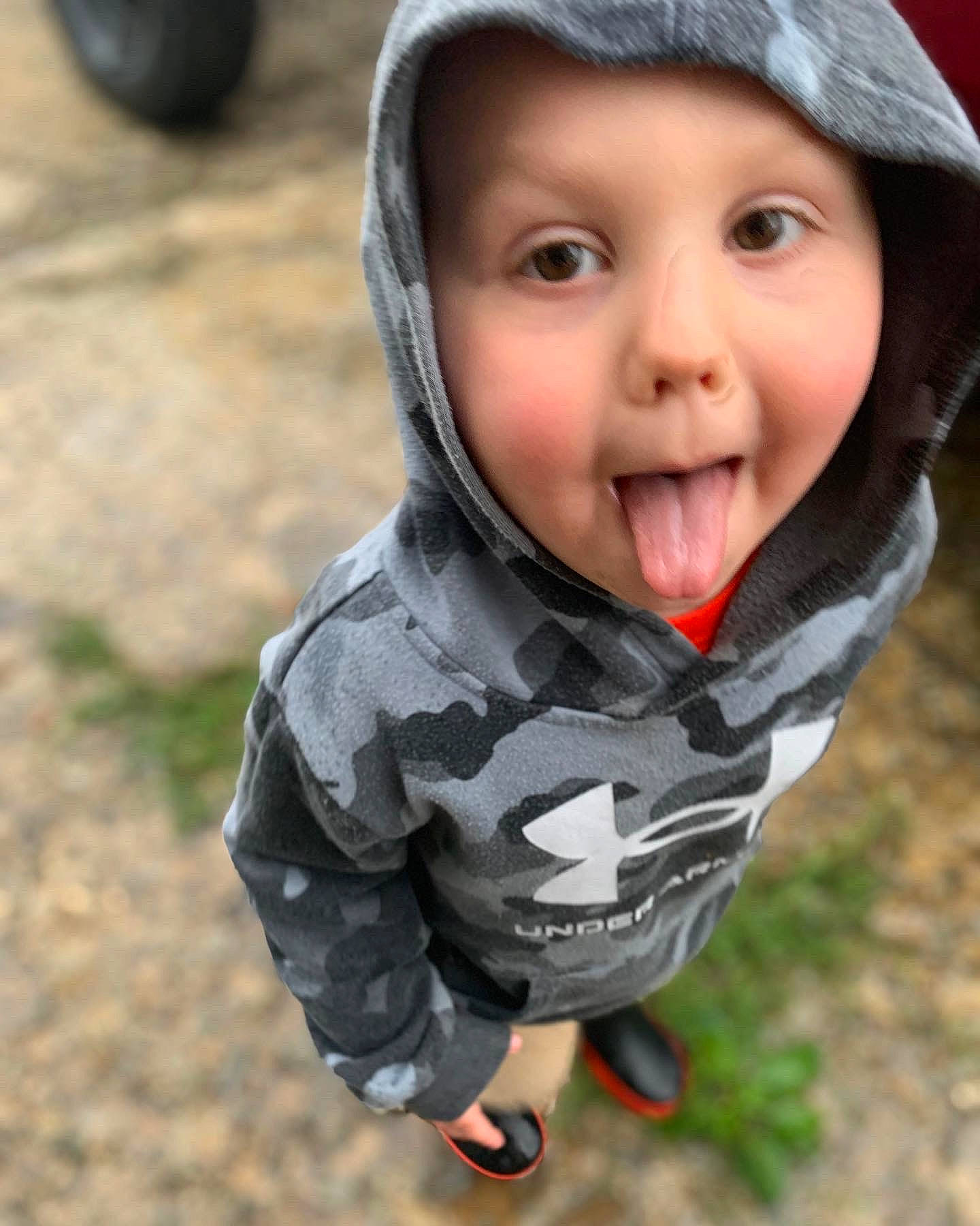 Jesse is registered to the contest to win money with this photo: cap, cheek, child, eye, fashion_accessory, finger, fun, grass, happy, headgear, headwear, jacket, lip, mouth, nose, people_in_nature, person, personal_protective_equipment, skin, smile