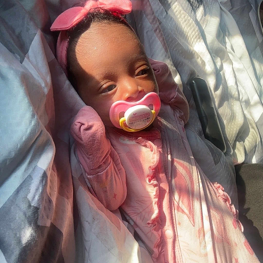 Dalaysia joined the competition — help win amazing prizes! baby, bedspread, blanket, child, cozy, cute, face, hands, headband, indoor, infant, pacifier, pattern, pink_clothing, portrait, resting, sleeping, sleepwear, soft_light, sunlight