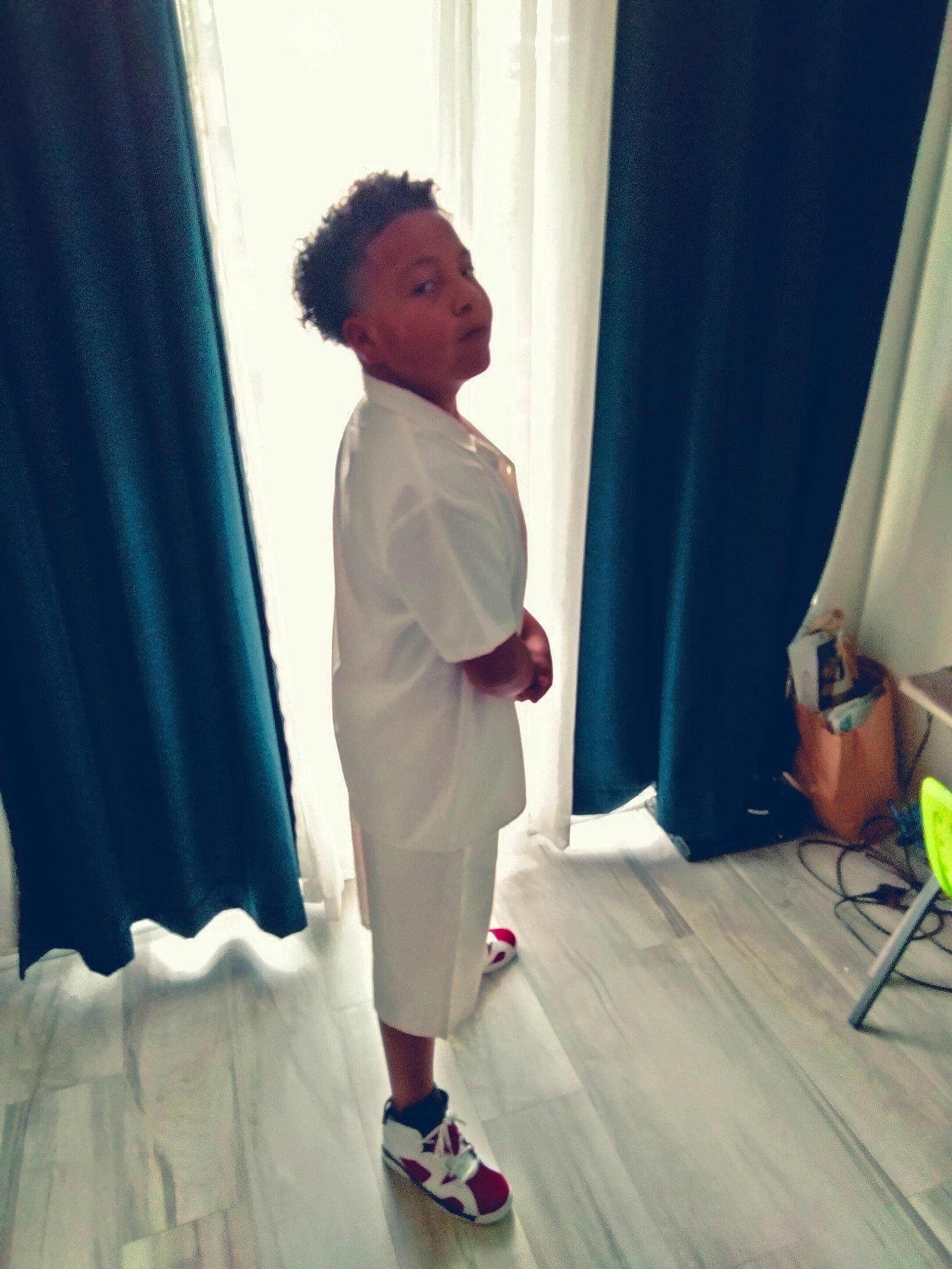 Juelz is registered to the contest to win money with this photo: chair, comfort, curtain, elbow, electric_blue, event, fashion_design, floor, flooring, formal_wear, fun, human_leg, joint, knee, leisure, magenta, person, room, shoulder, sleeve