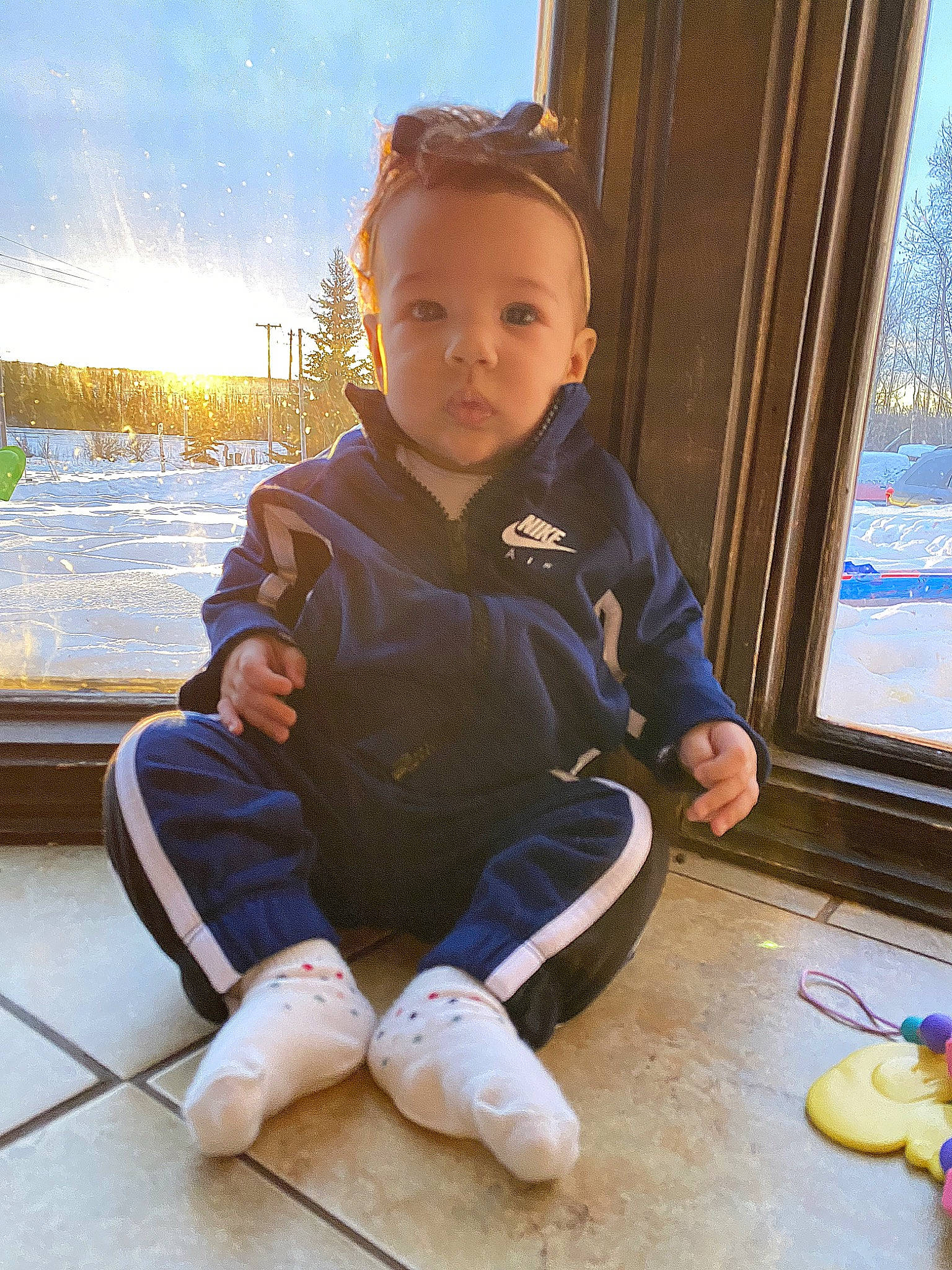 Isla joined the competition — help win amazing prizes! ankle, baby, baby_toddler_clothing, barefoot, child, curtain, daylighting, foot, person, sitting, slipper, sock, toddler, toe, window_blind, window_covering, window_treatment