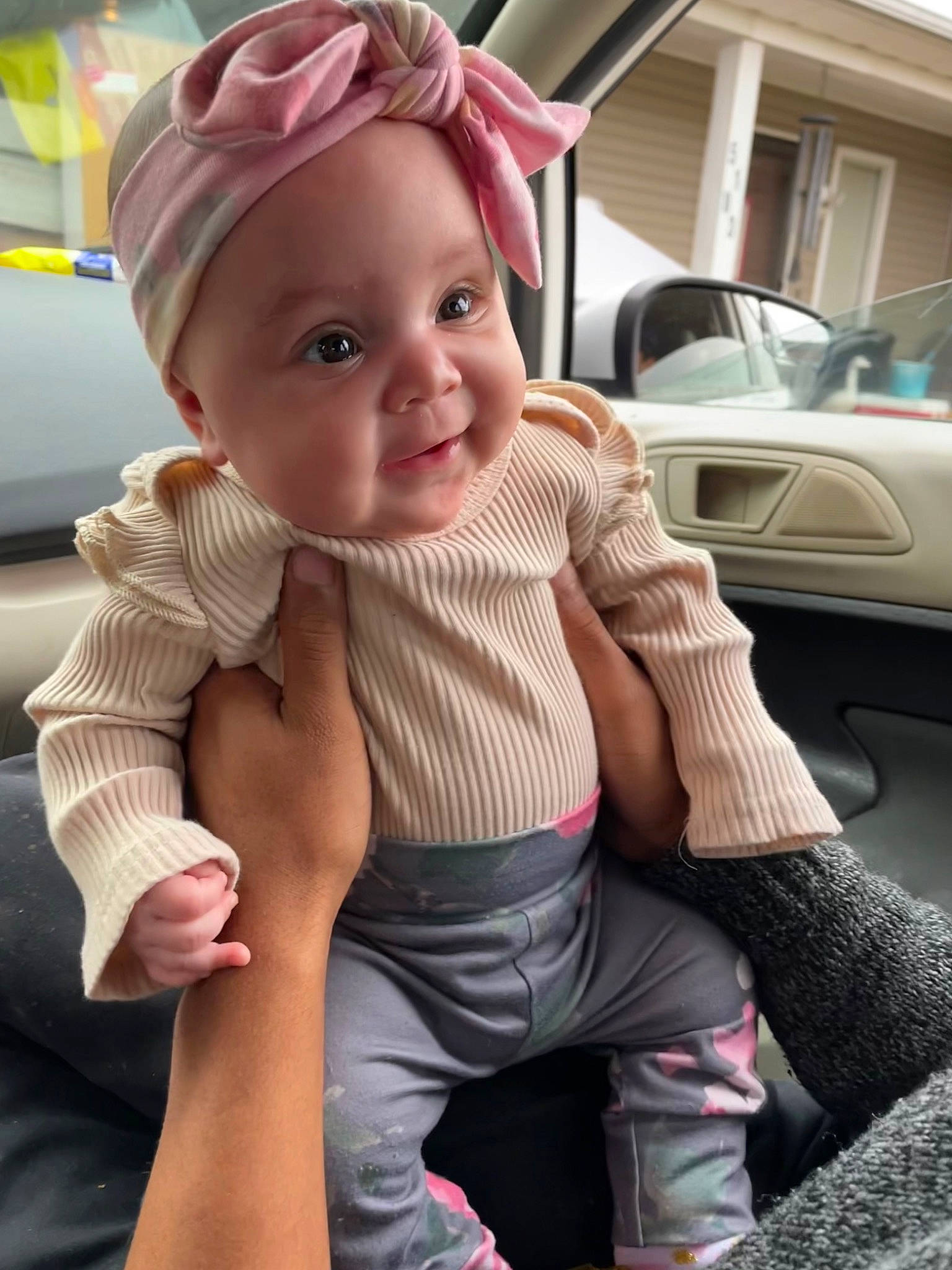 Ariella joined the competition — help win amazing prizes! baby, baby_toddler_clothing, baseball_cap, cap, finger, gesture, happy, hat, headwear, human_body, knee, lip, person, pink, skin, sleeve, smile, thigh, thumb, toddler