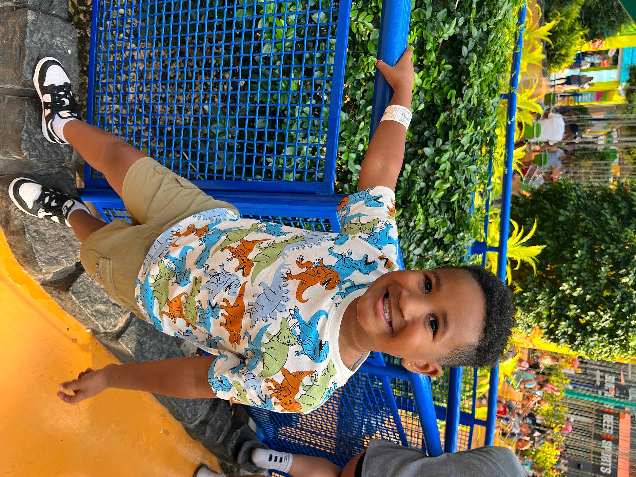 Adrian is registered to the contest to win money with this photo: blue, child, city, electric_blue, event, fun, grass, happy, joy, leisure, outdoor_play_equipment, person, plant, play, playground, recreation, smile, summer, swing, thigh