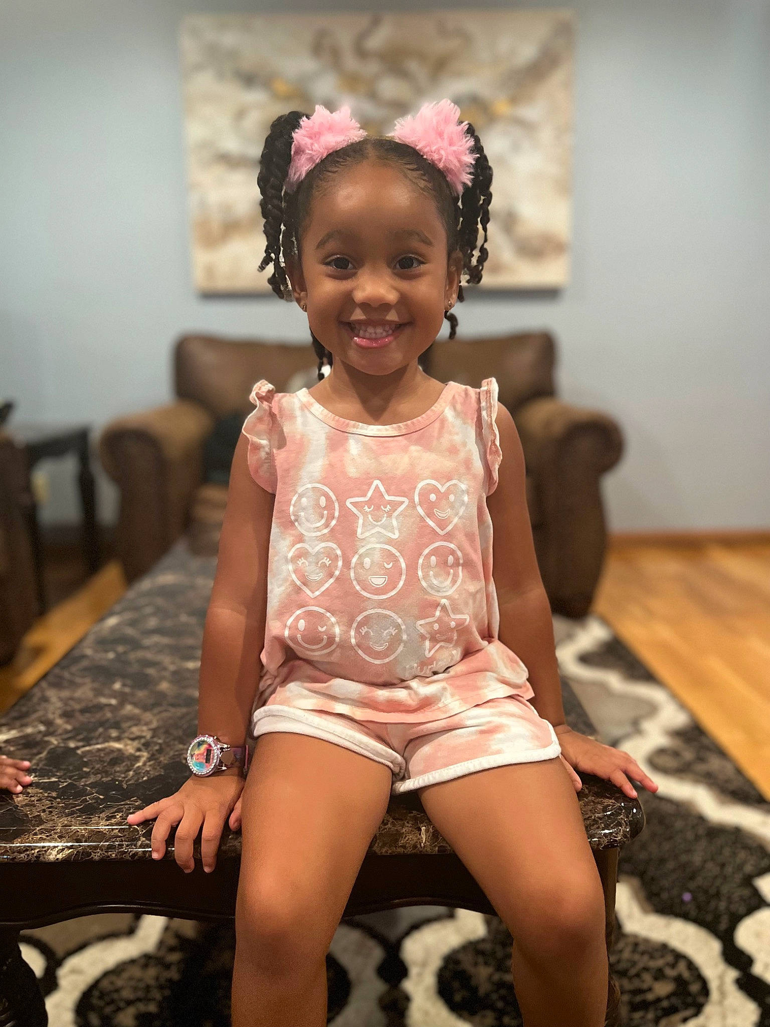 Alina is registered to the contest to win money with this photo: abdomen, barefoot, black_hair, brown_hair, event, fashion_accessory, fashion_design, flash_photography, happy, head, human_leg, joy, leg, neck, person, pink, shorts, sitting, smile, table