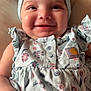 Keyonna-Lee is registered to the contest to win money with this photo: baby, child, smiling, headband, bow, dress, floral_pattern, ruffles, cute, infant, happy, portrait, closeup, hand, soft_toys, pillow, indoors, skin, face, person