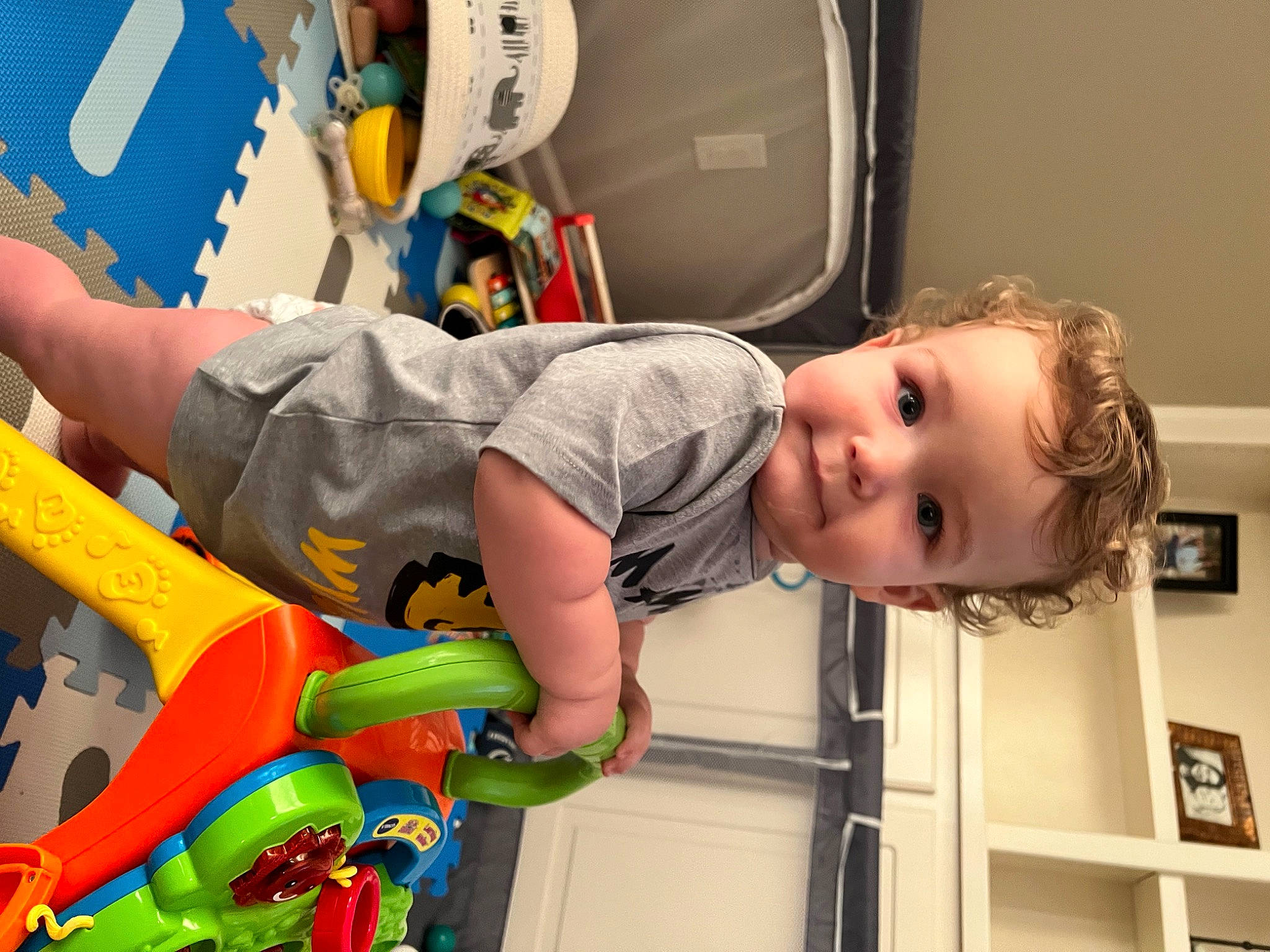 Cooper is registered to the contest to win money with this photo: baby, baby_playing_with_toys, baby_products, baby_toys, child, fun, happy, leisure, people, person, photography, picture_frame, play, recreation, room, smile, t_shirt, toddler, toy, toy_vehicle