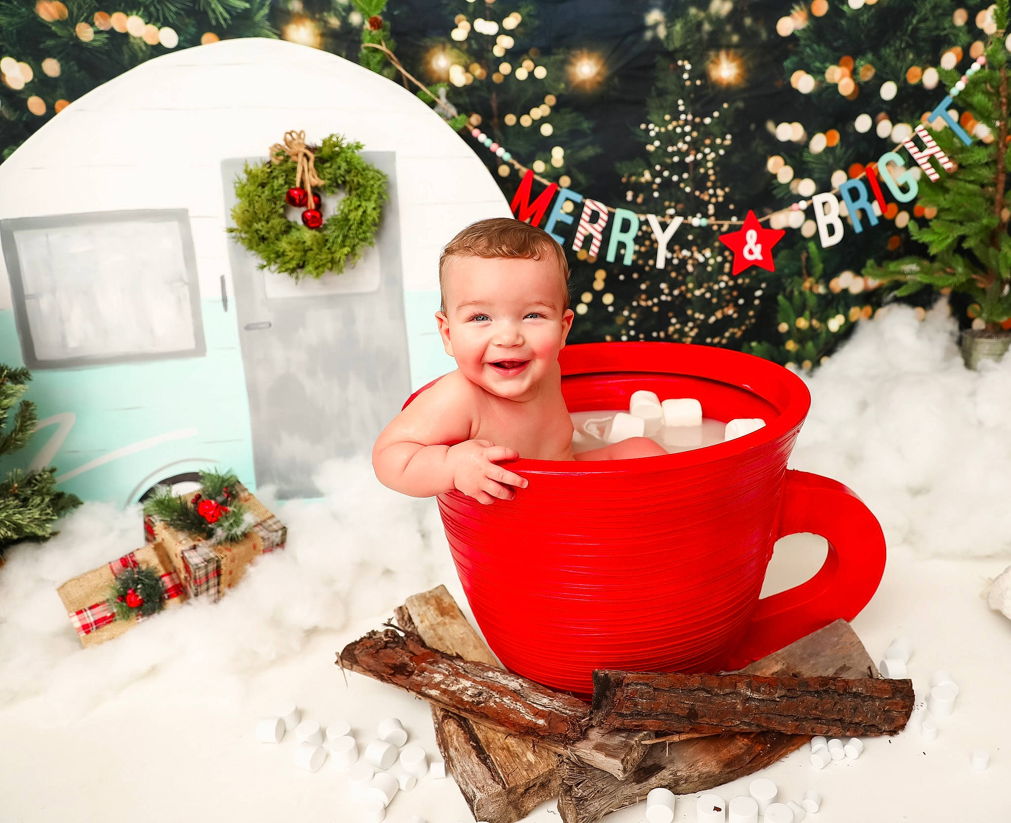 Cooper is registered to the contest to win money with this photo: baby, baby_toddler_clothing, child, christmas_decoration, christmas_ornament, christmas_tree, cup, drinkware, event, facial_expression, happy, head, holiday_ornament, human_body, joy, ornament, person, plant, red, smile