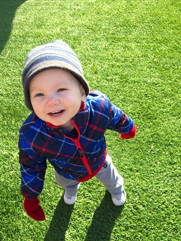 Leif joined the competition — help win amazing prizes! baby_toddler_clothing, cap, eye, face, grass, grass_family, grassland, green, happy, headwear, human_body, joy, leaf, leisure, people_in_nature, person, plaid, plant, recreation, smile