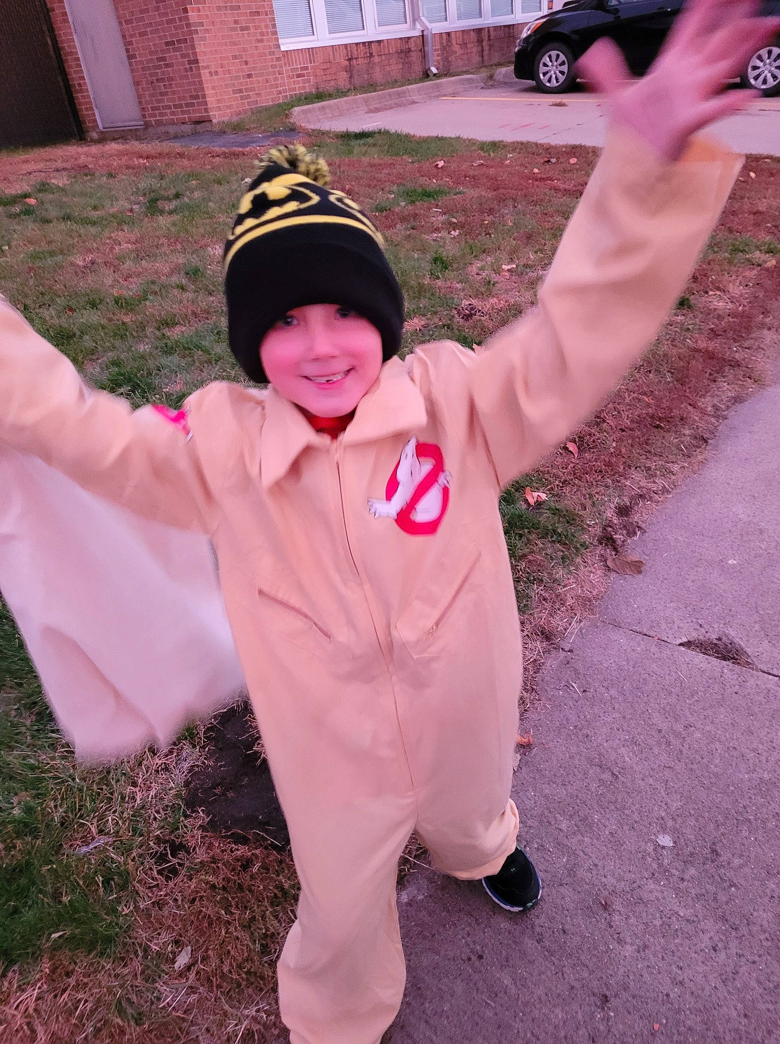 Broderick joined the competition — help win amazing prizes! automotive_exterior, baseball_cap, cap, car, family_car, finger, fun, gesture, grass, happy, headwear, joy, magenta, person, pink, plant, sleeve, smile, thumb, tire