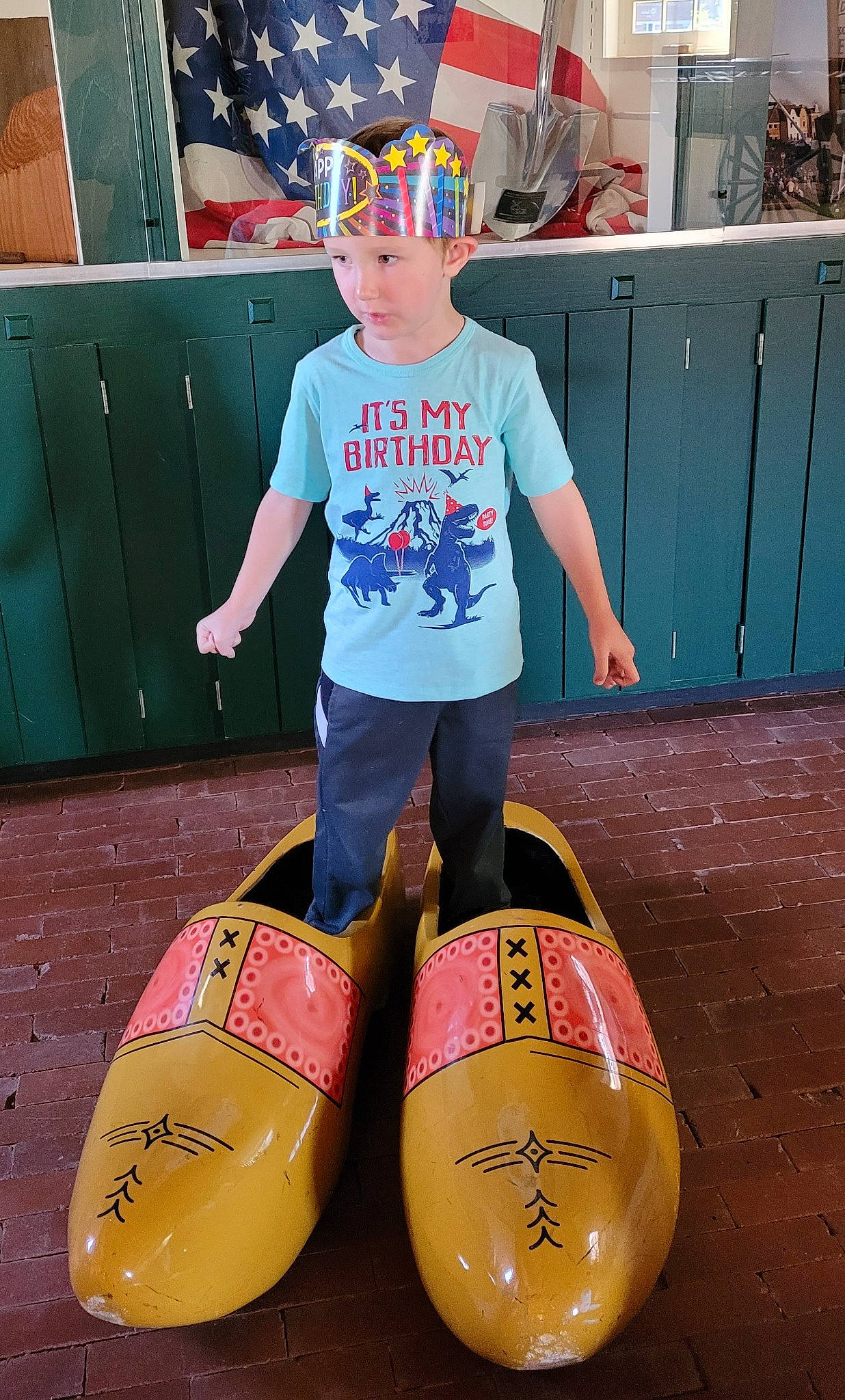 Broderick is registered to the contest to win money with this photo: cabinetry, clothing, cool, electric_blue, fun, happy, headwear, leisure, magenta, person, personal_protective_equipment, photograph, recreation, sleeve, snapshot, sunglasses, t_shirt, thigh, tints_and_shades, toddler