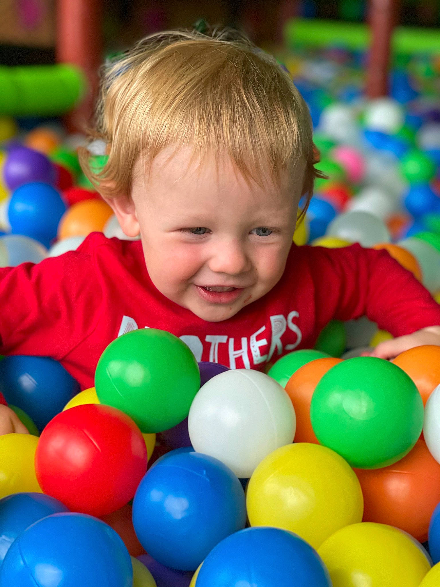 Braylon joined the competition — help win amazing prizes! baby, baby_playing_with_toys, ball, ball_pit, child, face, facial_expression, fun, grass, happy, joy, leisure, people, people_in_nature, person, photograph, product, smile, t_shirt, toddler