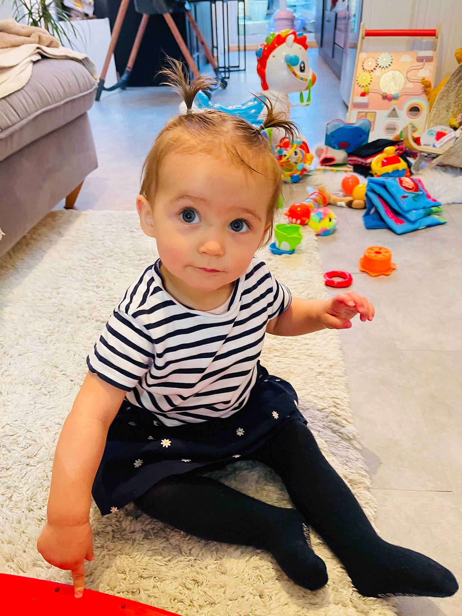 Ellie participe au concours pour gagner de l'argent avec cette photo : baby, baby_playing_with_toys, baby_toddler_clothing, child, event, flooring, fun, happy, hardwood, leisure, person, photograph, play, red, sitting, sleeve, smile, snapshot, toddler, white