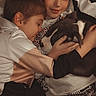 Laïka participe au concours pour gagner de l'argent avec cette photo : children, boys, puppy, dog, pet, cuddling, hugging, sleeping, smiling, portrait, indoors, couch, family, companionship, brown_hair, white_shirt, sweatshirt, jeans, cozy, wholesome