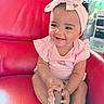Dioř Aahmoř joined the competition — help win amazing prizes! baby, child, smiling, pink_clothing, headband, bow, sitting, red_chair, happy, indoors, shoe, cute, infant, person, portrait, furniture, curly_hair, skin_tone, toddler, playful