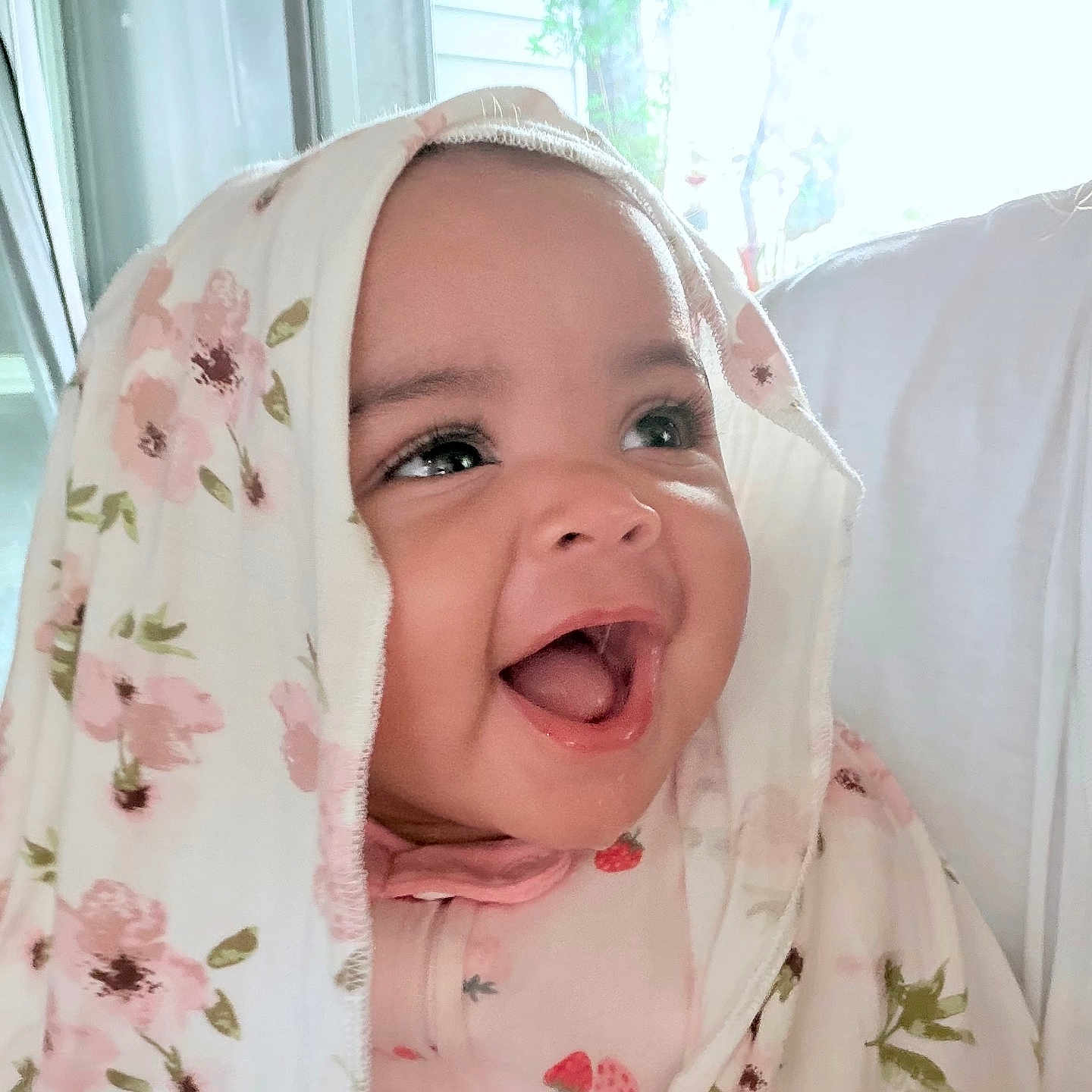 Dioř Aahmoř joined the competition — help win amazing prizes! baby, child, smiling, happy, face, blanket, floral_pattern, indoors, natural_light, portrait, cute, clothing, infant, person, head, joy, expression, cozy, soft, wrapped