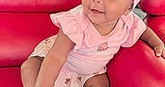 Dioř Aahmoř joined the competition — help win amazing prizes! baby, child, pink_clothing, headband, shoe, couch, red_couch, sitting, cute, infant, smiling, indoors, curious, happy, person, toddler, furniture, comfortable, portrait, casual