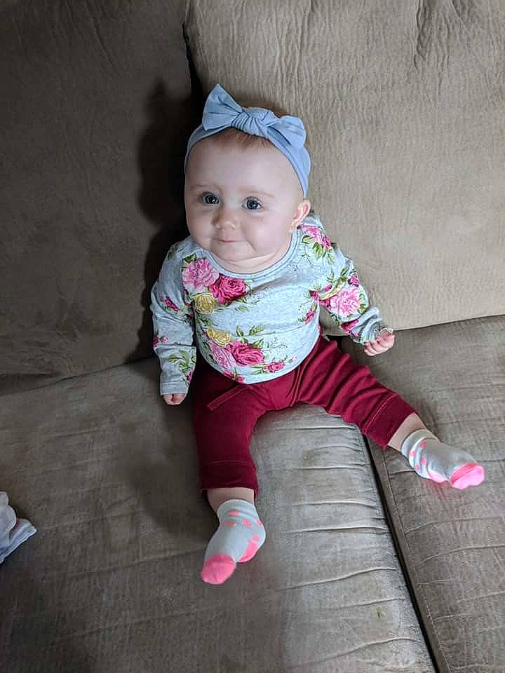 Avery joined the competition — help win amazing prizes! baby_products, child, eye, fun, girl, hair_accessory, headgear, infant, outerwear, person, pink, product, sitting, skin, smile, textile, toddler