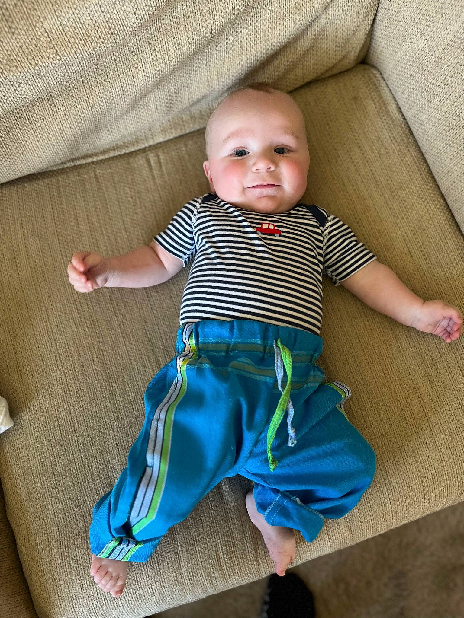 Thodore is registered to the contest to win money with this photo: azure, baby, baby_toddler_clothing, comfort, electric_blue, eye, finger, happy, head, human_body, iris, pattern, person, skin, sleeve, smile, t_shirt, textile, toddler, trunk