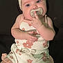 Emory joined the competition — help win amazing prizes! baby, infant, pacifier, headband, bow, flower_pattern, clothing, cute, child, skin, hand, face, eyes, lying_down, soft_light, portrait, indoors, expression, adorable, young