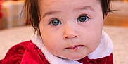 Alyara joined the competition — help win amazing prizes! baby, bokeh, carpet, child, christmas, cute, expression, face, festive, hair_bows, hand, holiday, indoors, infant, lights, portrait, red_clothing, stockings, velvet, warm_lighting