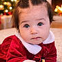 Alyara joined the competition — help win amazing prizes! baby, child, infant, holiday, christmas, red_clothing, velvet, hair_bows, cute, carpet, indoors, festive, stockings, lights, bokeh, portrait, face, hand, expression, warm_lighting