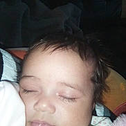 Heavenly is registered to the contest to win money with this photo: baby, sleeping, child, infant, portrait, face, closed_eyes, brown_hair, blanket, bed, indoors, peaceful, nap, flash_photography, close_up, pajamas, pink_clothing, resting, peaceful_expression, soft_lighting