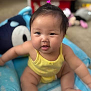 Linoa Grace joined the competition — help win amazing prizes! baby, child, sitting, yellow_clothing, blue_cushion, indoors, face, hair_tie, toy, blurred_background, cute, chubby_cheeks, person, infant, smiling, plush, soft, comfortable, home, curious
